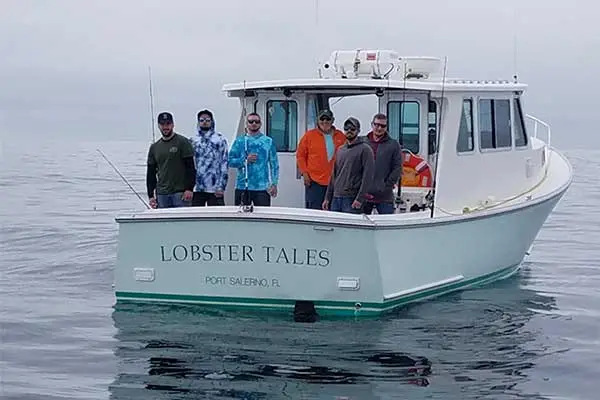Anglers enjoying a summer offshore fishing trip with Tuna Tail Charters in Gloucester, catching bluefin tuna on the boat