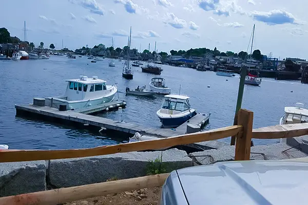 Boats docked at Cripple Cove Landing include Tuna Tail Charters' vessel ready for next trip.